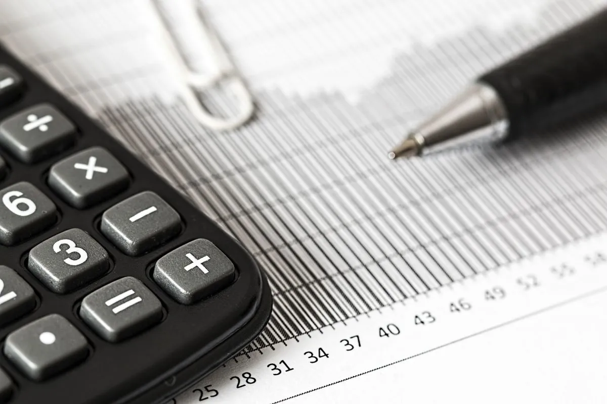 An accounting desk with documents and office equipment