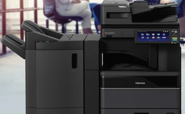A full-size Toshiba multifunction copier — the class of machine a Print Navigator assessment evaluates