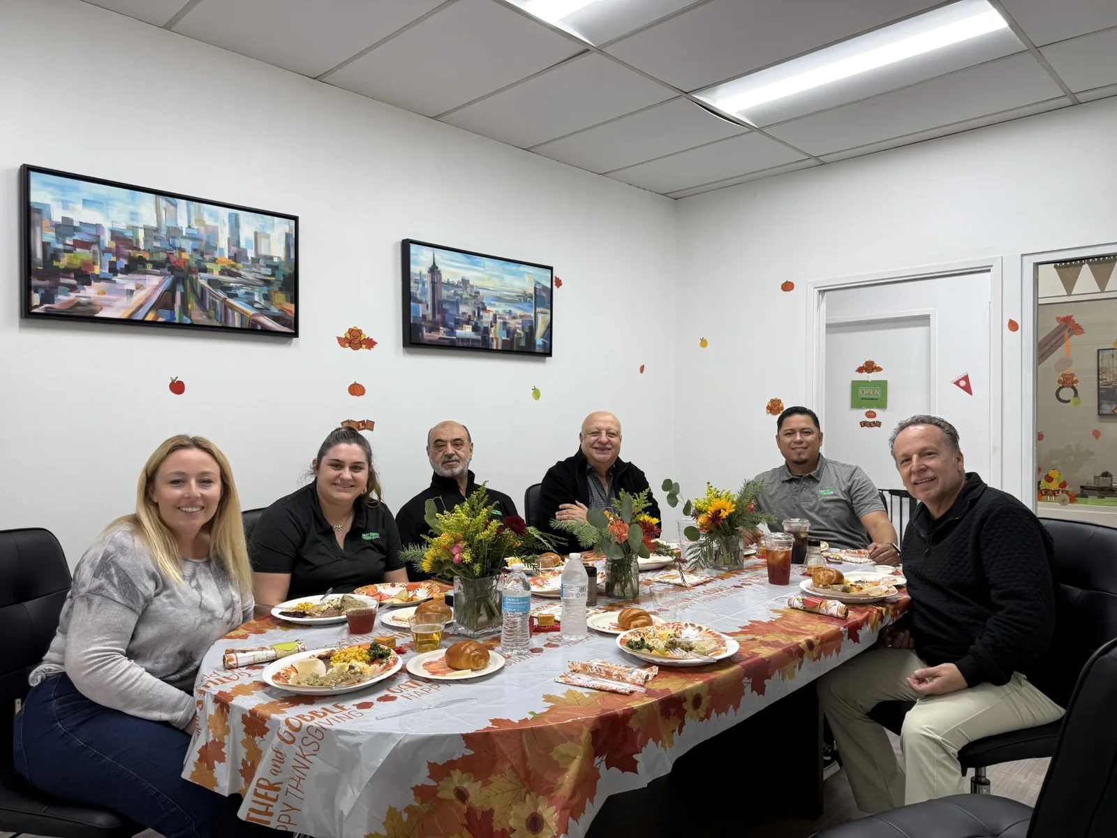 The Next Level Business Strategies team sharing lunch in the Irvine office