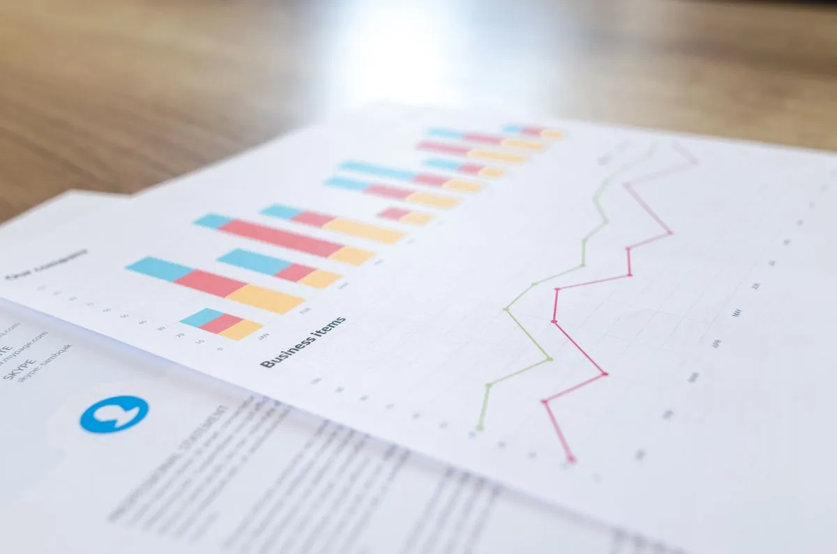 A Print Navigator cost report with charts on paper